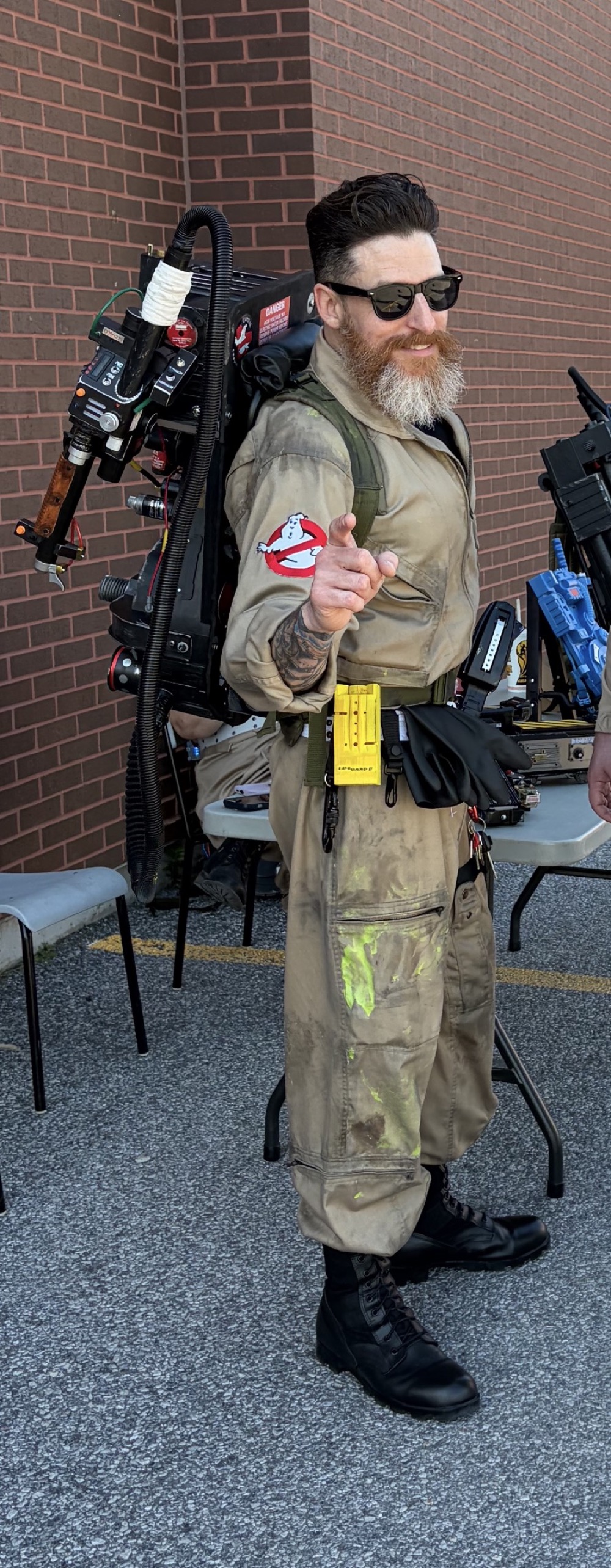 Ryan McFonz wearing a proton pack and Ghostbusters flight suit