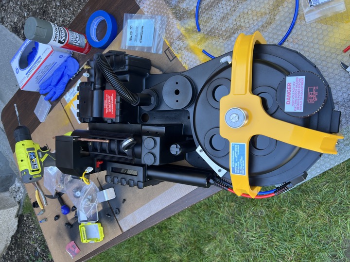 Overhead view of the pack during assembly, with tools and fittings nearby.