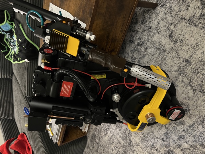 Three-quarter view of the proton pack and wand indoors.