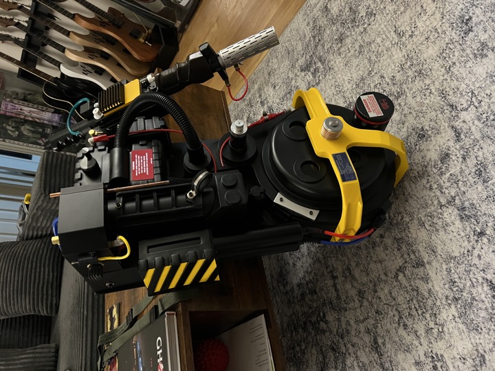 Front view showing the yellow bumper and matching accents on the pack and wand.