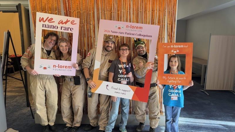 Ghostbusters volunteers and event attendees posing with photo frames at an n-Lorem Foundation event.