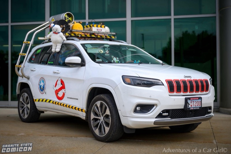 White Ghostbusters-themed Jeep with roof equipment and Massachusetts Ghostbusters branding. Photo credit: Adventures of a Car Girl; Granite State Comicon.