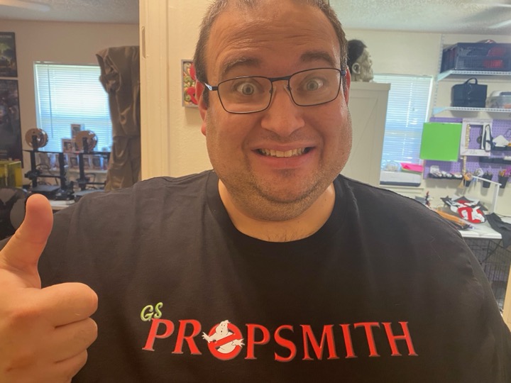 GSPropsmith shirt and a thumbs-up in the workshop.