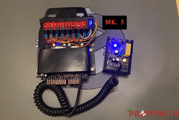 GSPropsmith MK. 5 belt gizmo with illuminated red displays, colorful wiring, and a coiled cable.